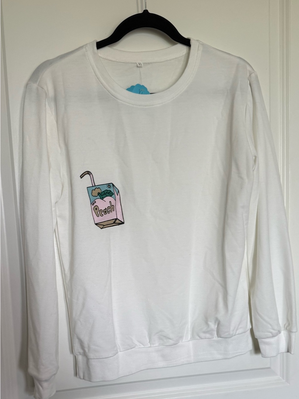 White Women's Long-Sleeve Sweatshirt with Peach Juice Box Graphic